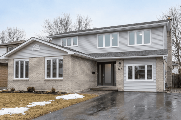 Barrie, Ontario home exterior with new windows and a front entry door.